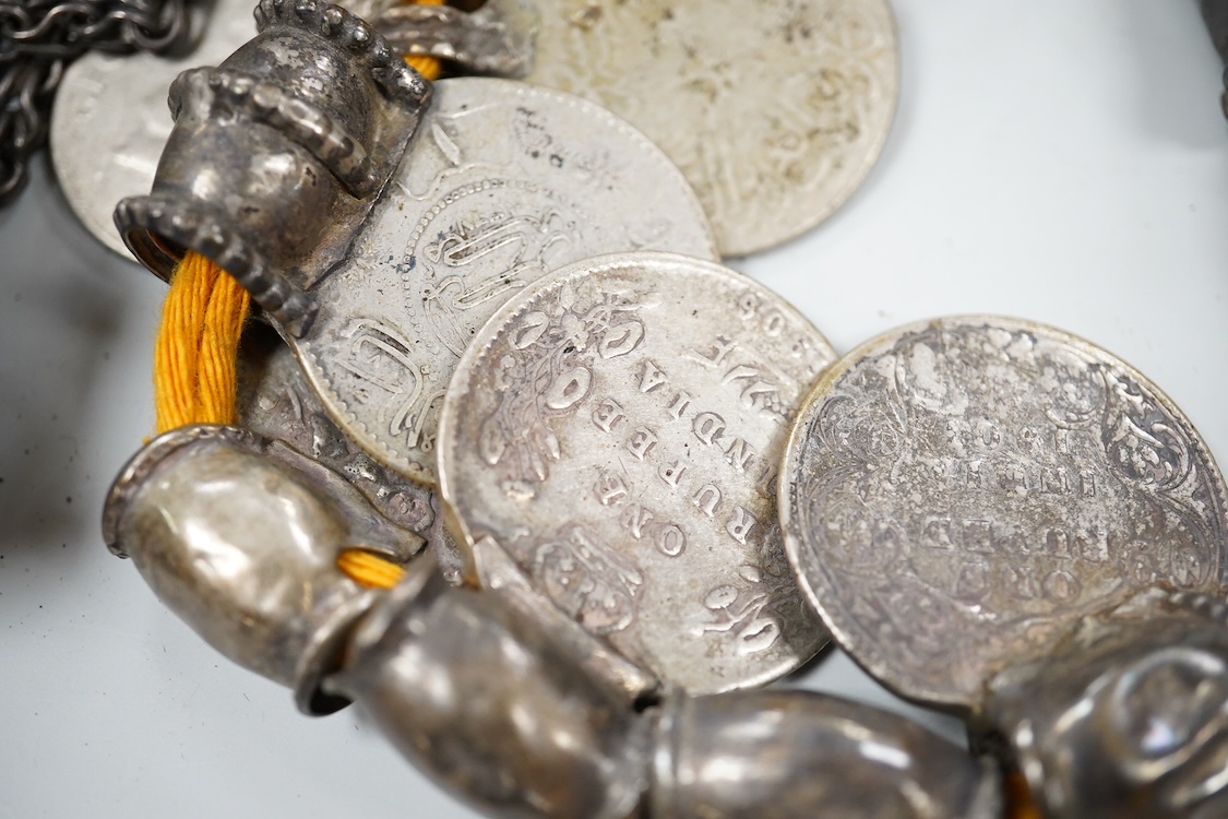 A collection of Bedouin white metal, gilt metal, lapis lazuli mounted jewellery, etc. from Oman